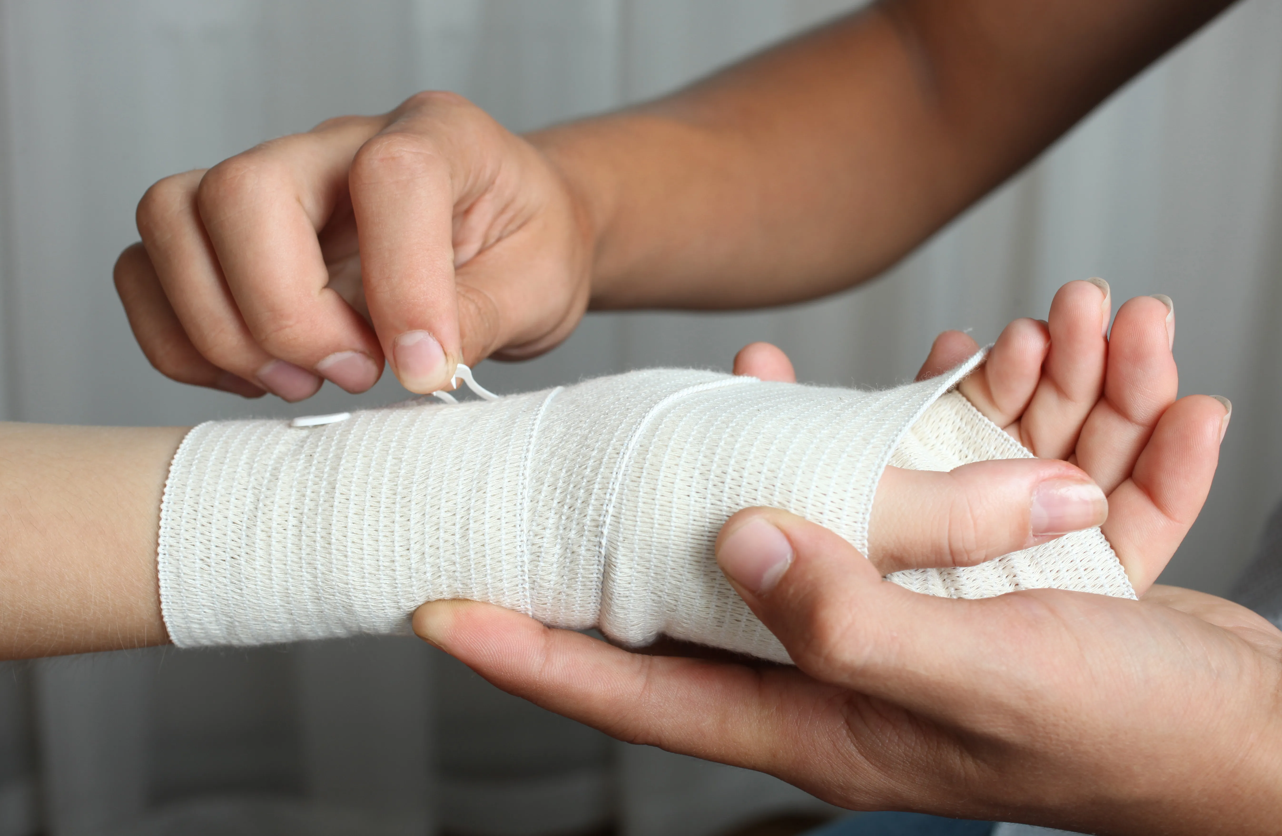 Young girl holding a teddy bear during a gentle exam – we see patients of all ages.